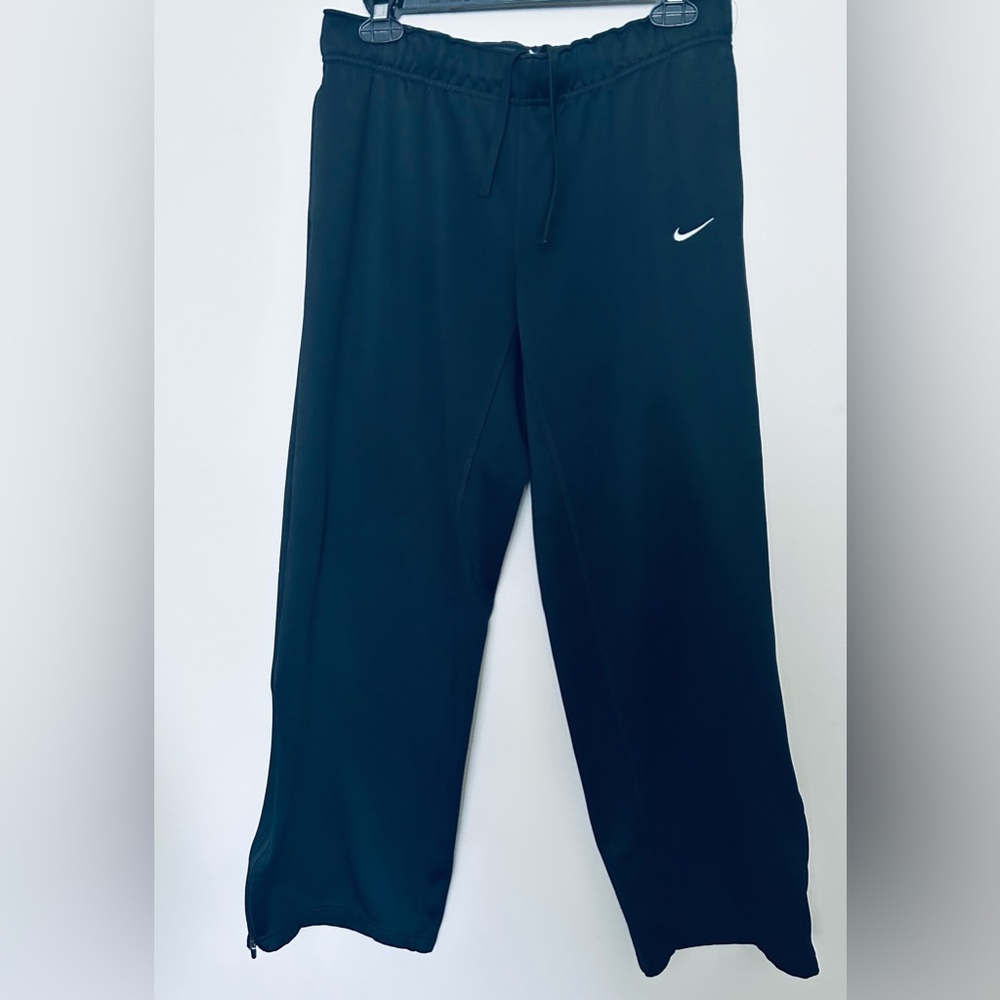 Nike Black Track Pants with drawstring and zip up at ankle. EUC